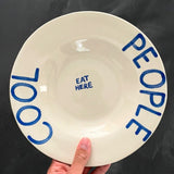 cool people eat here bord in hand