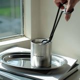 Metal bloom kaars aansteken